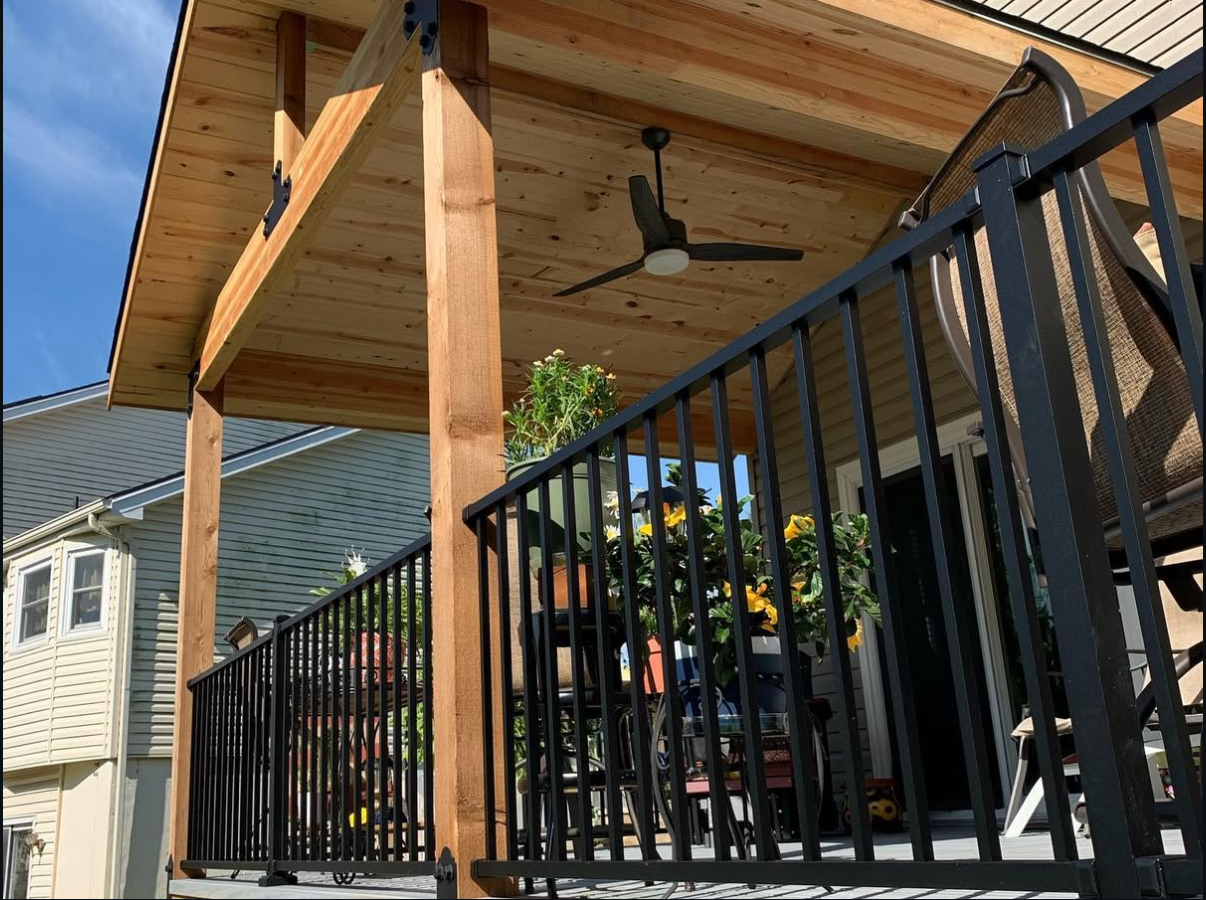 Covered porch with cedar ceiling and ceiling fan