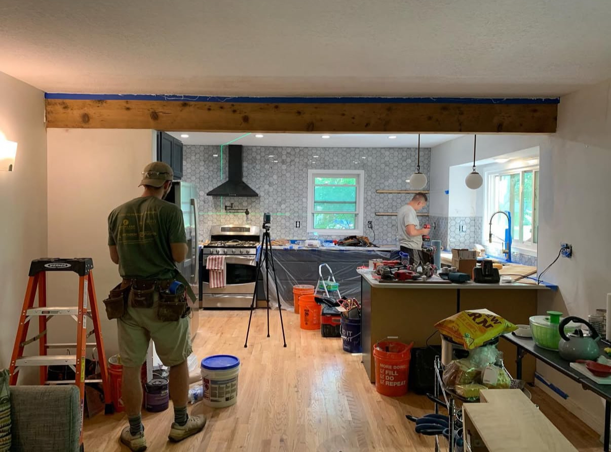Kitchen renovation in progress showing team at work