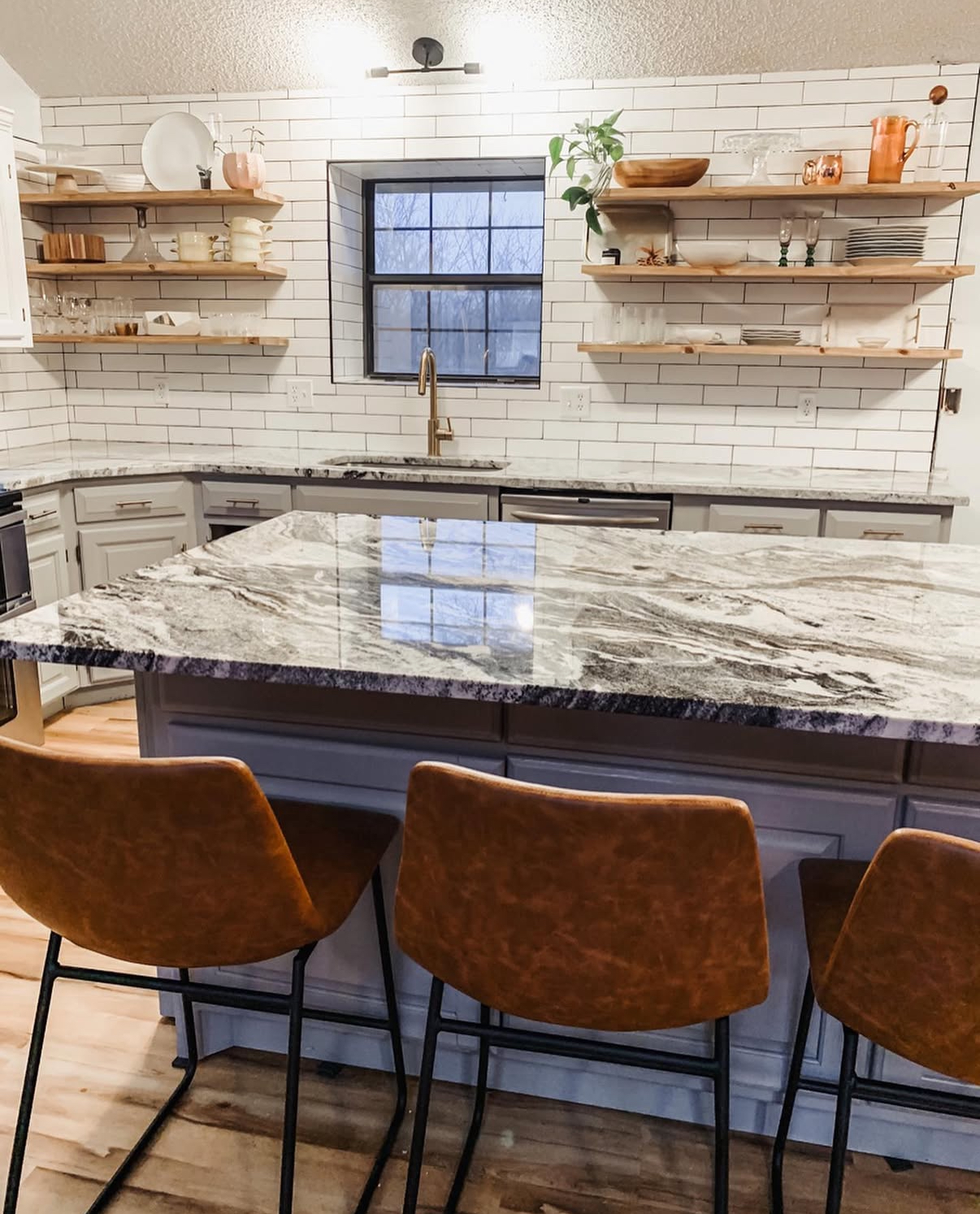 Modern kitchen renovation with marble countertops